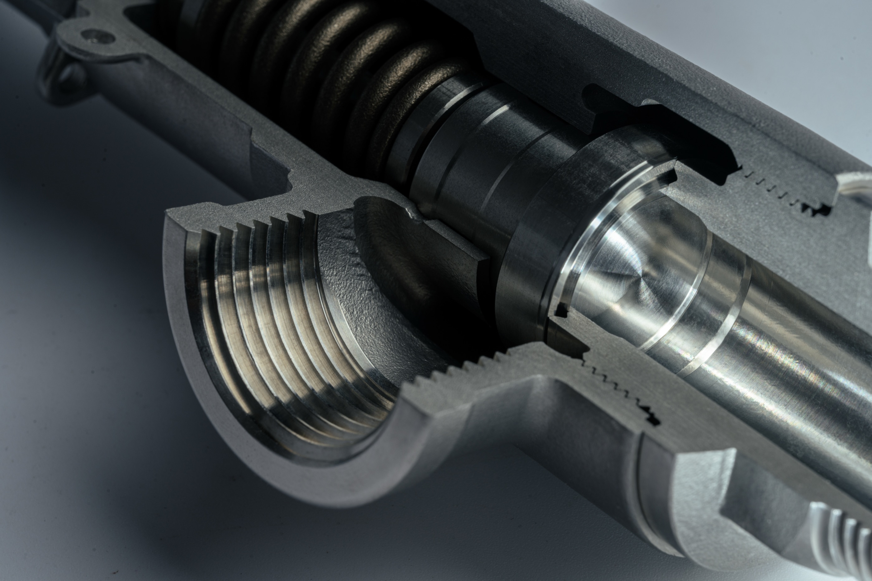A real Hopeet safety valve cut in half, showing the spring chamber, threads and seat